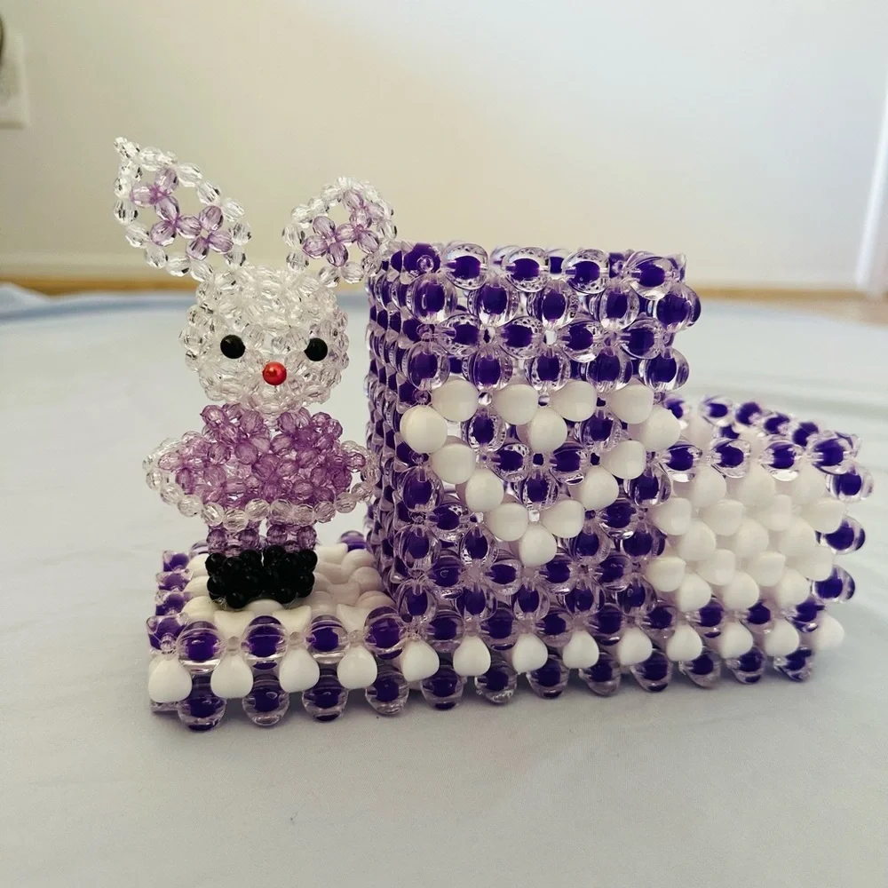 A cute little bunny pencil holder handmade beads in shades